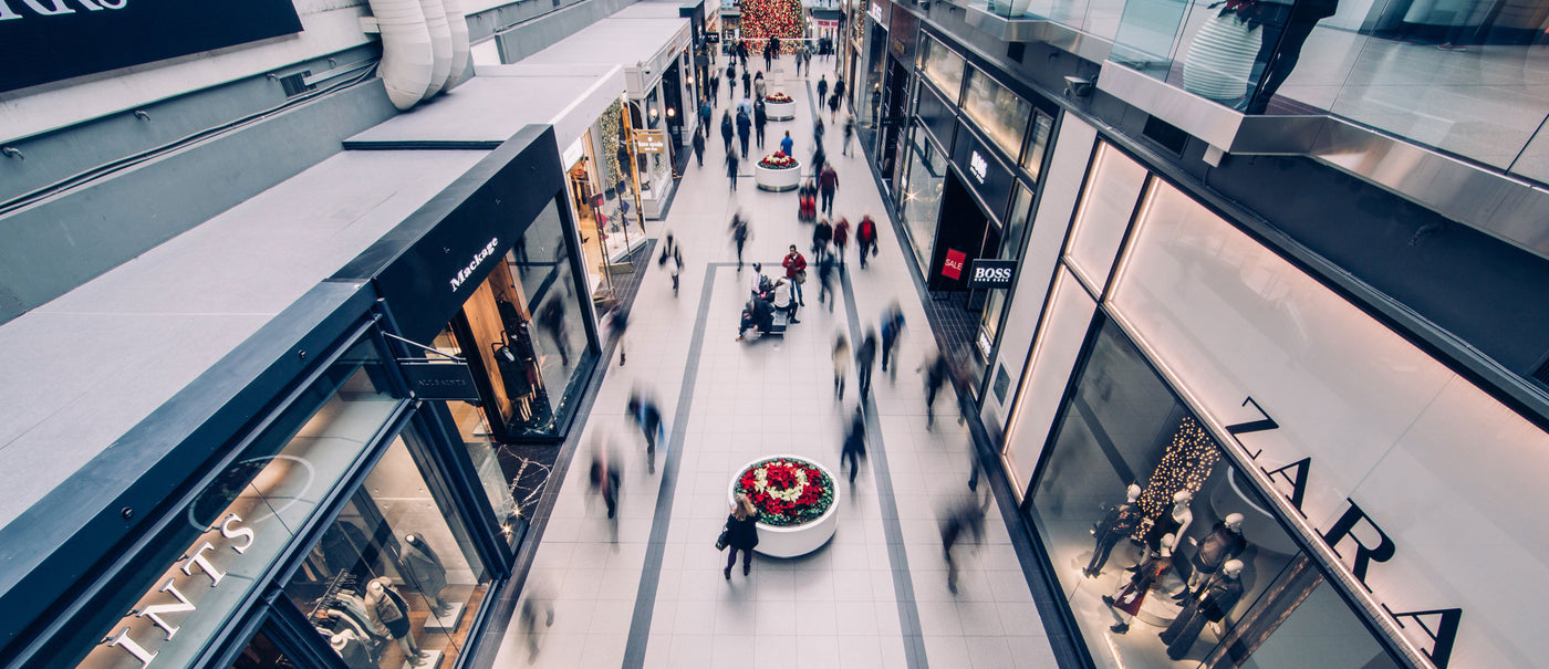 Busy shopping mall with lots of people.