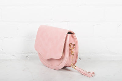 Photo of light pink accessory purse.